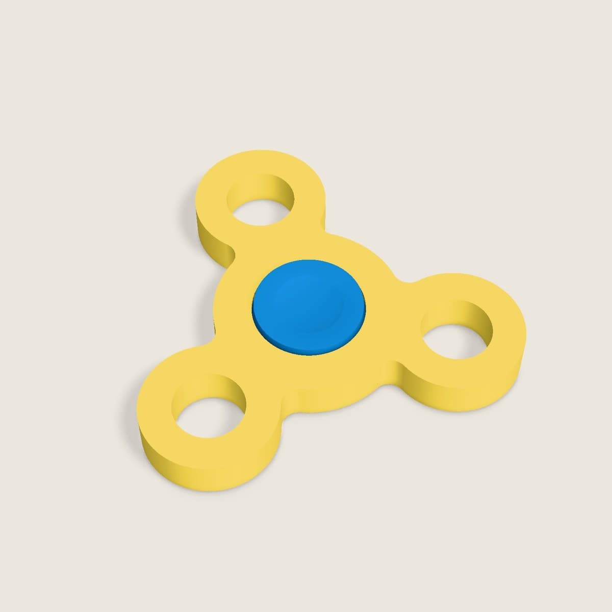 Fidget-spinner ovenfra: gul kropp med tre ringarmer og blått nav.